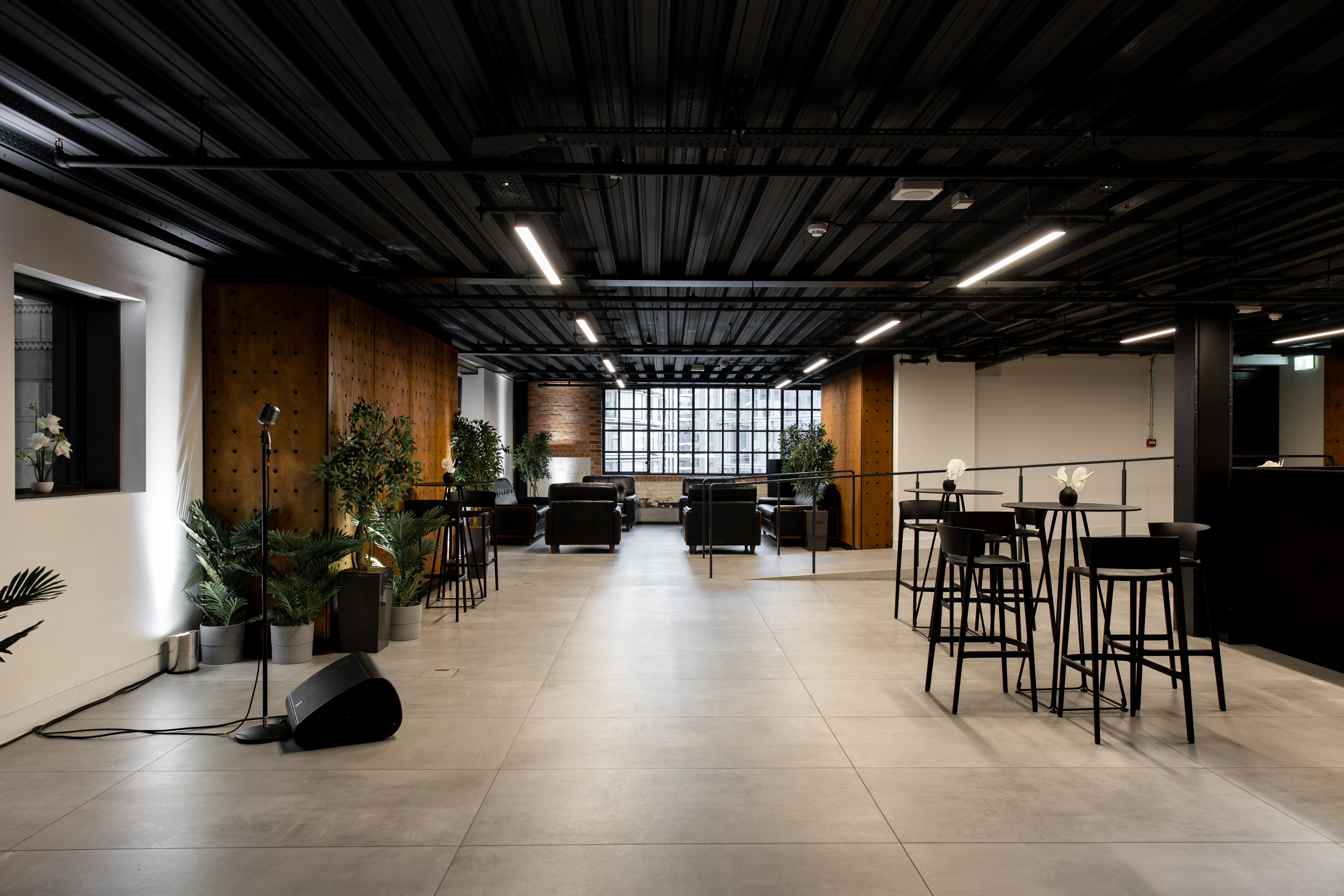 Control Room A at Battersea Power Station, modern industrial event space with microphone.