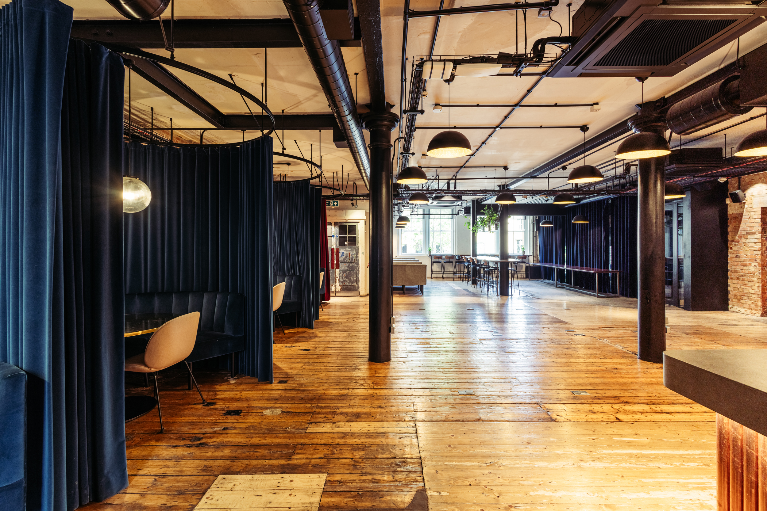 Versatile event space with modern design, ideal for meetings and networking events.