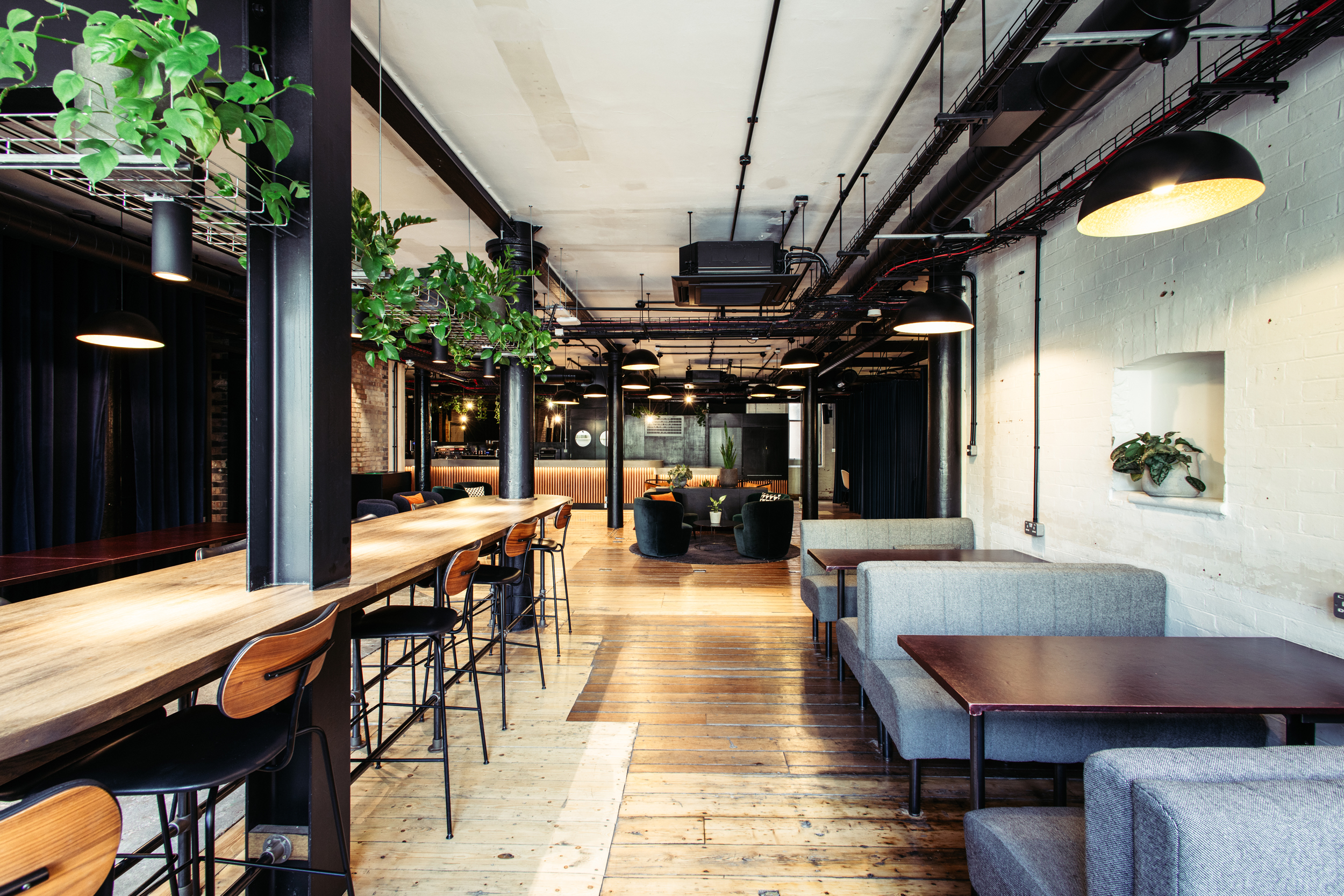 Modern event space with natural light, ideal for corporate and creative gatherings.