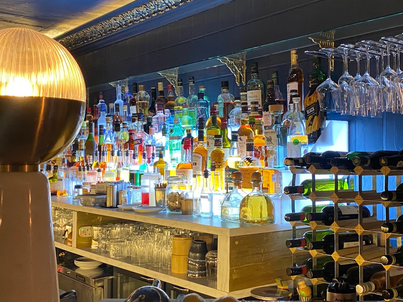 Vibrant bar setup with colorful liquor bottles for networking events and social gatherings.