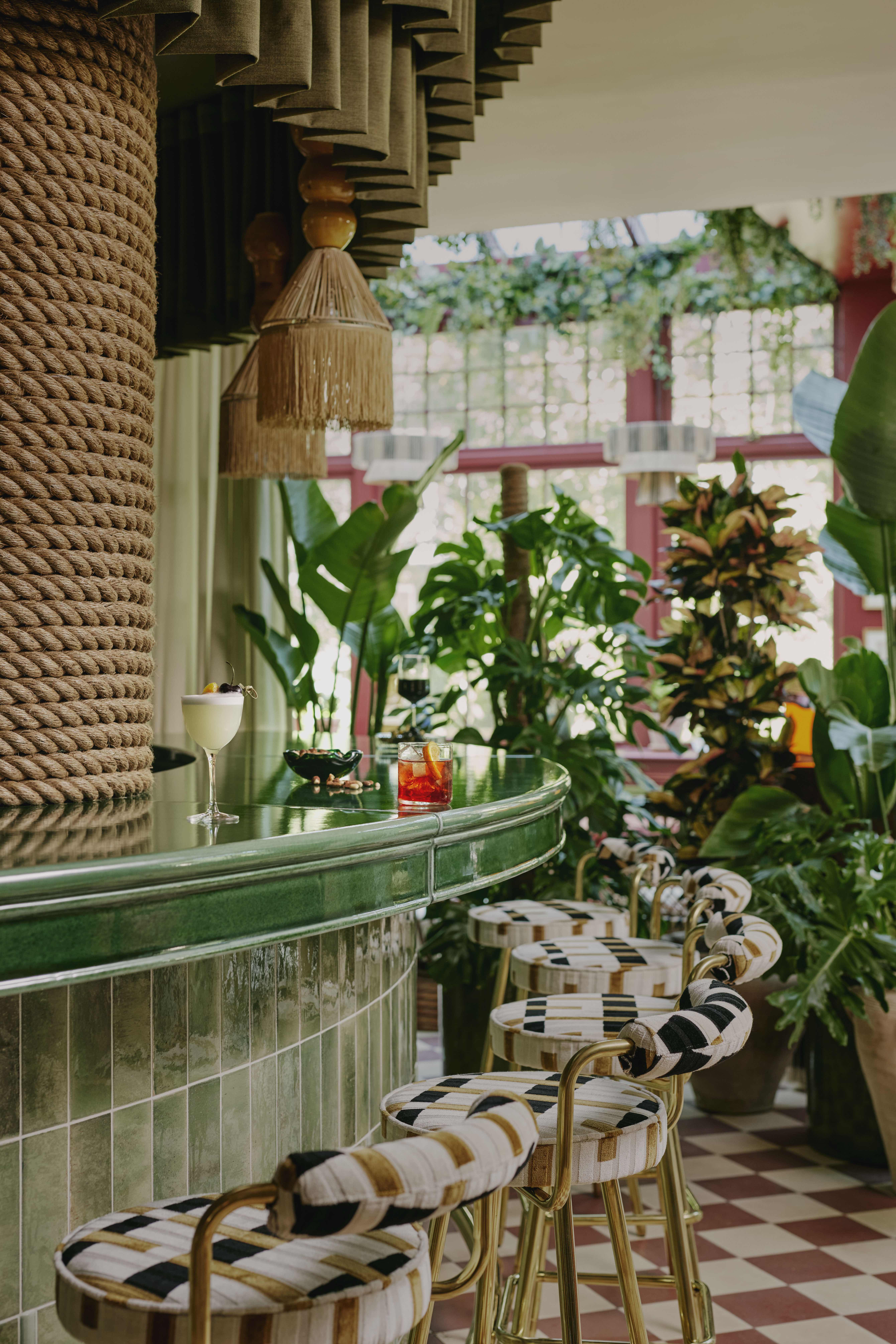 Vibrant bar area in EVE Kensington's Conservatory, perfect for networking events and cocktail receptions.