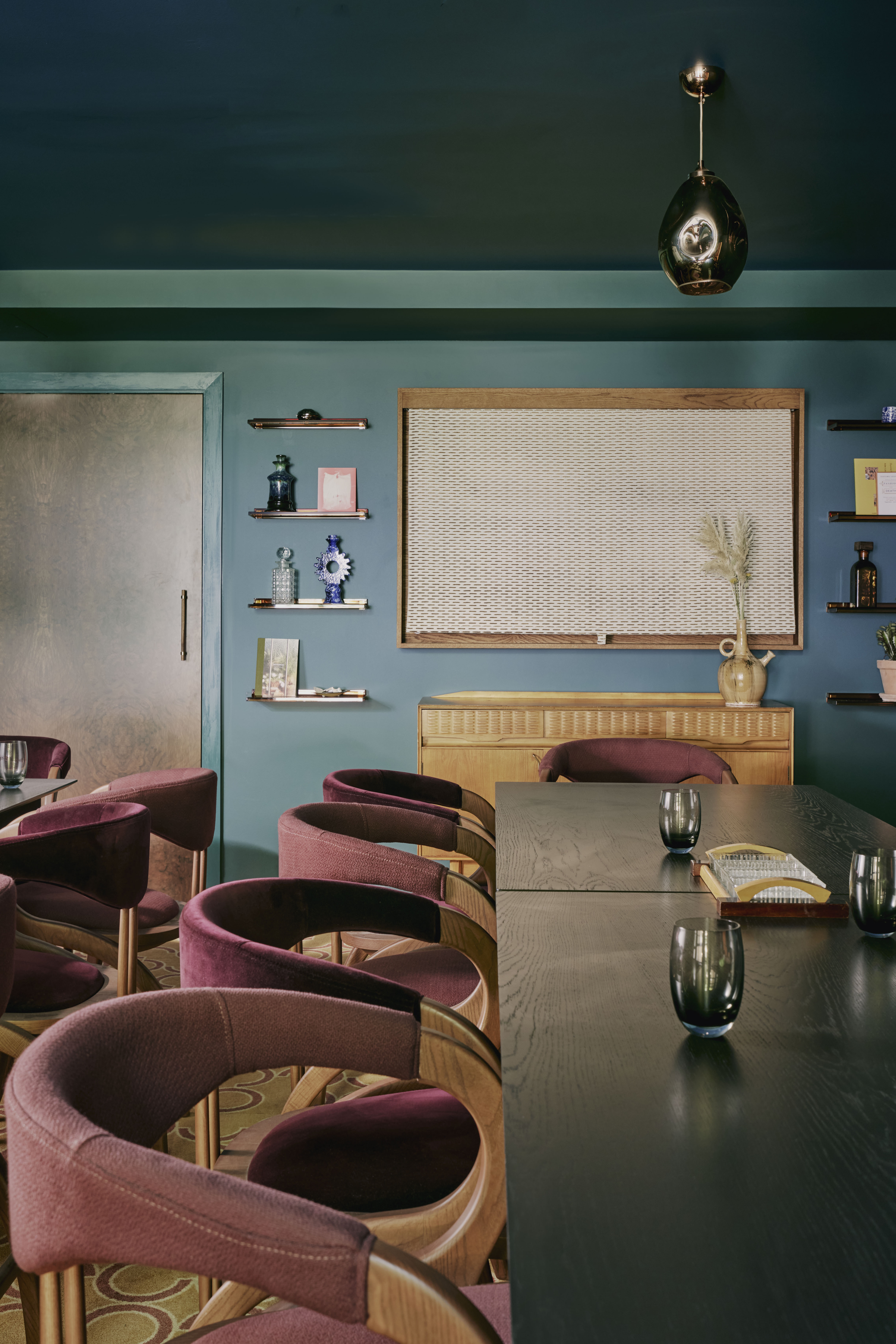 Private dining room in EVE Kensington, modern furnishings for intimate meetings and gatherings.