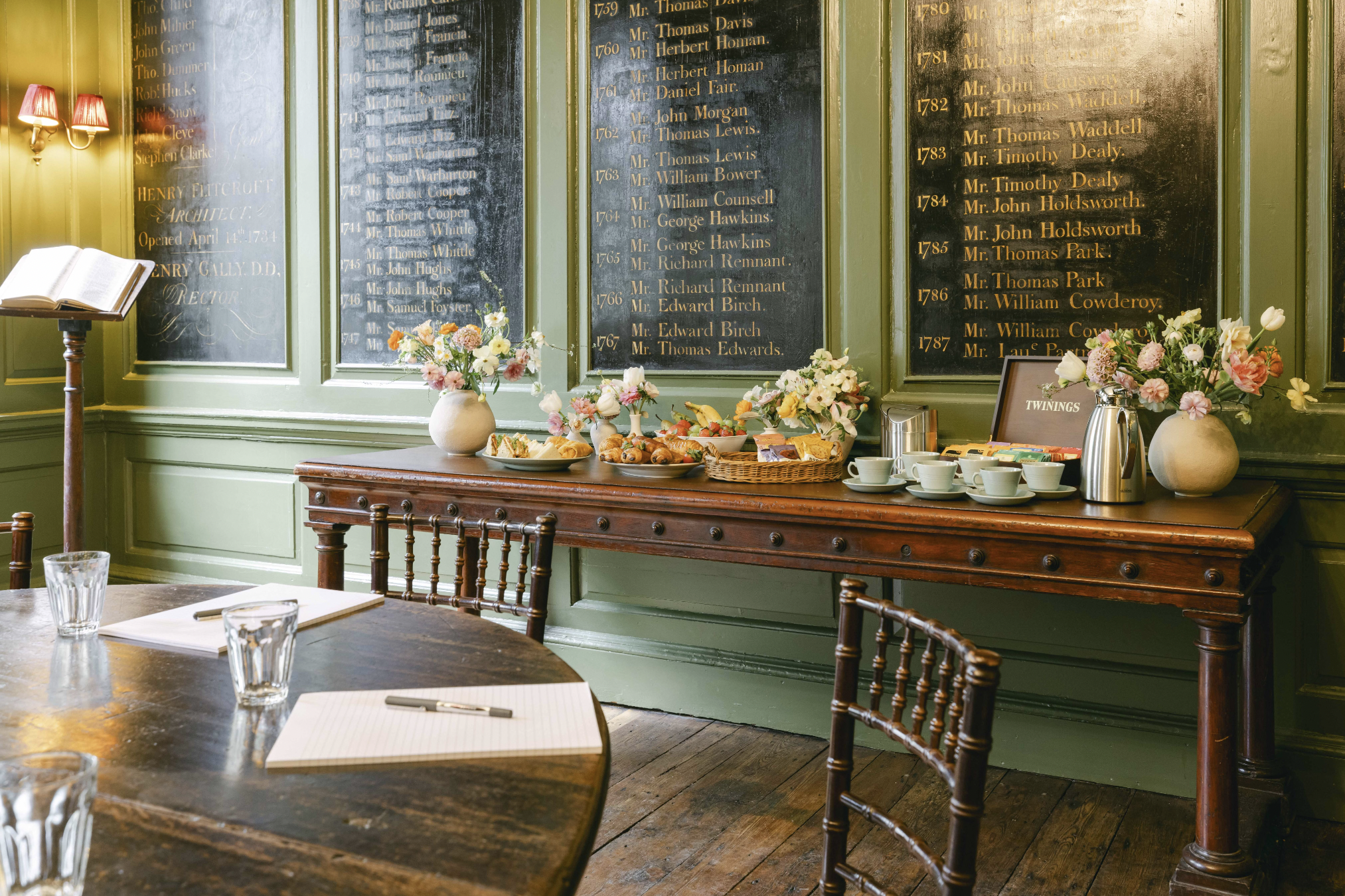 Vestry House meeting space with wooden table, ideal for workshops and gatherings.