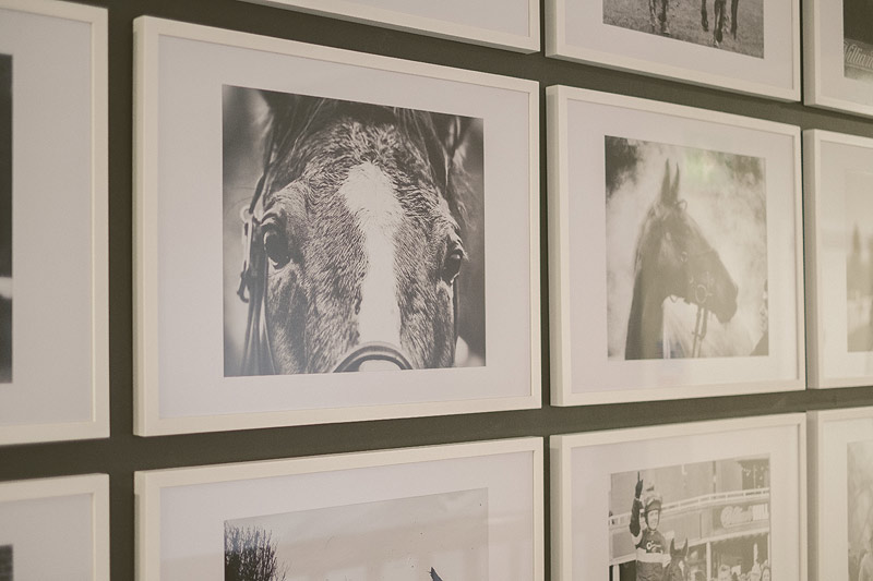 Royal Box at Kempton Park Racecourse with horse-themed gallery wall for elegant events.