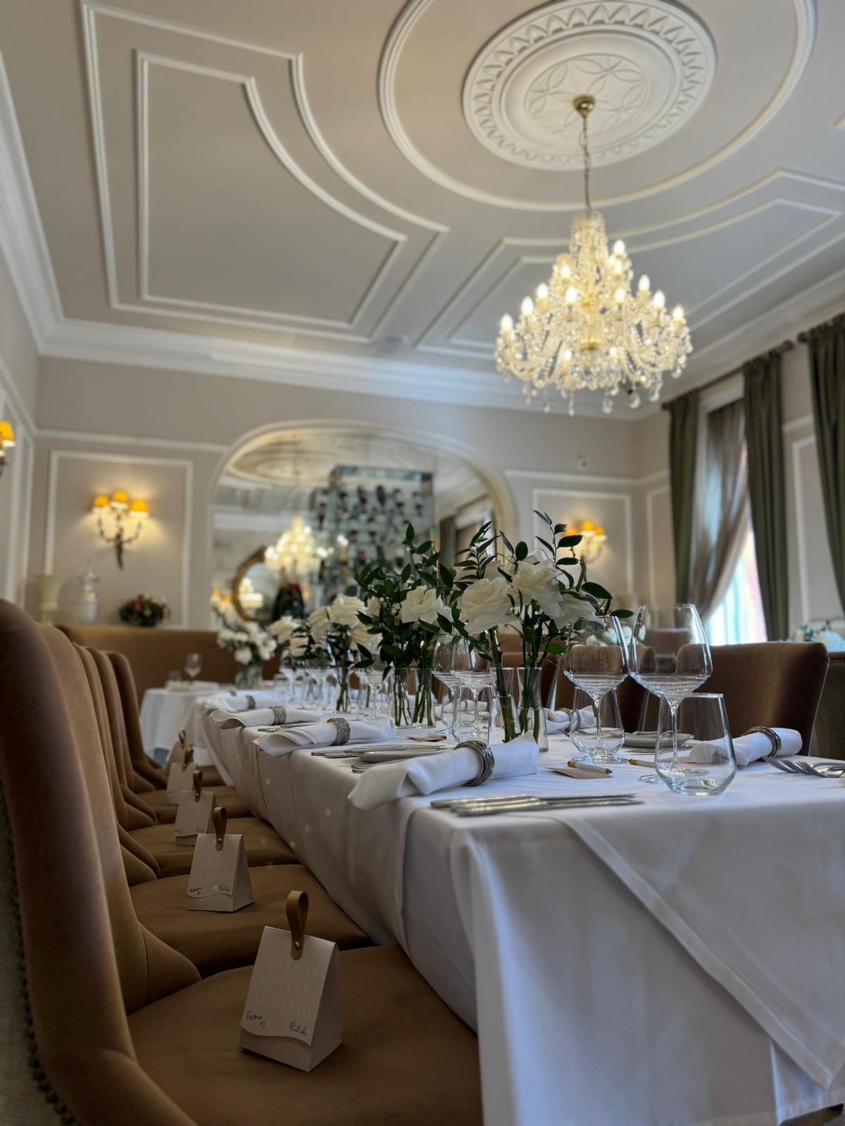 Elegant dining room with floral centerpieces for upscale events at St Paul's Hotel.