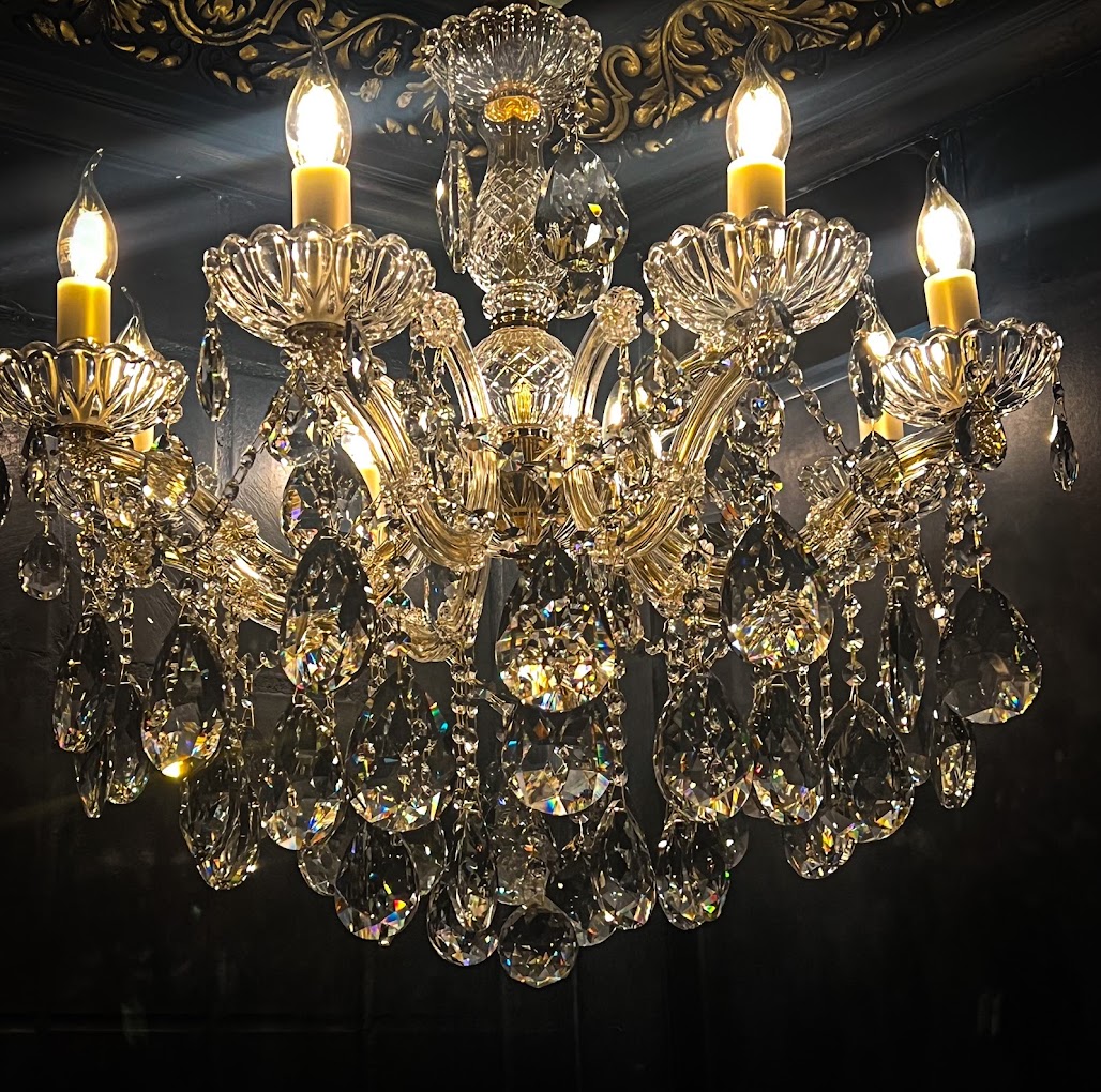 Elegant chandelier in The Rabbit's Hole bar, perfect for upscale events and celebrations.