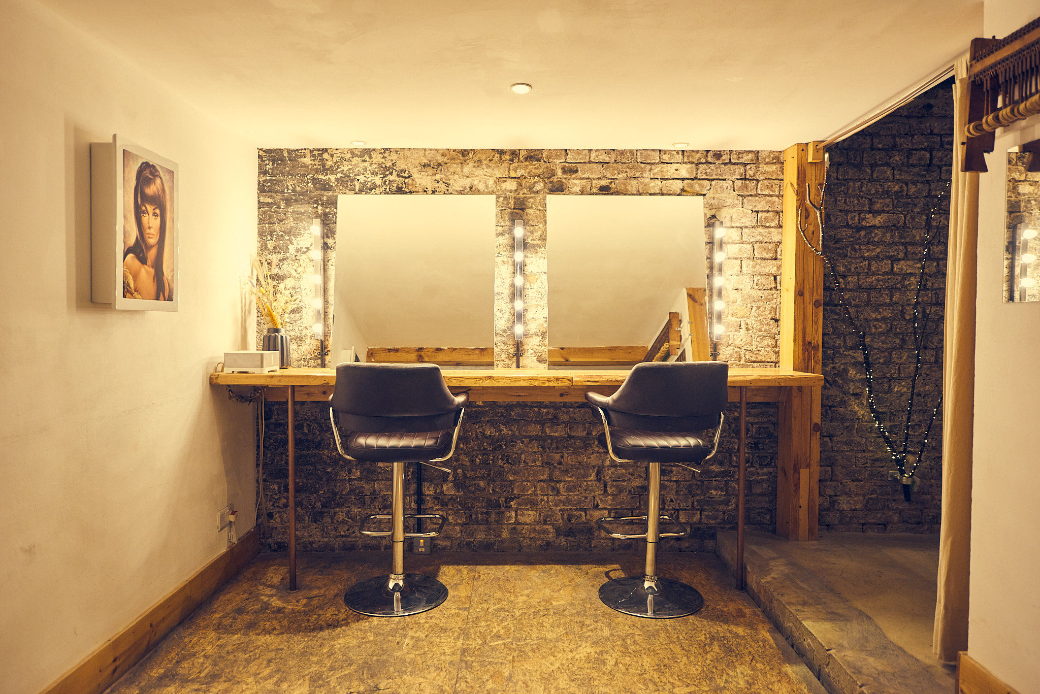 Stylish backstage area with vanity and stools in MOTEL Studio 3 for events.