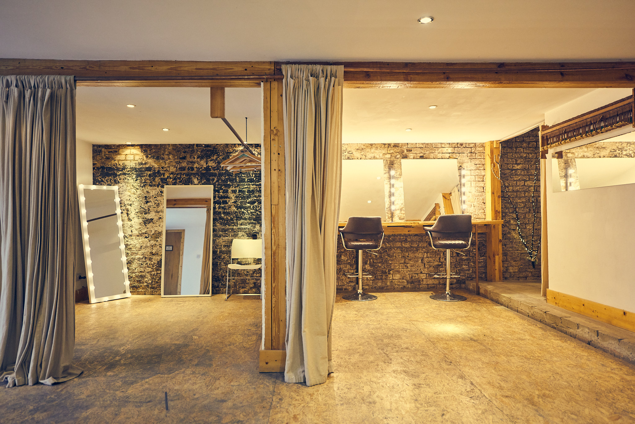 Versatile event space with exposed brick, ideal for workshops and networking events.