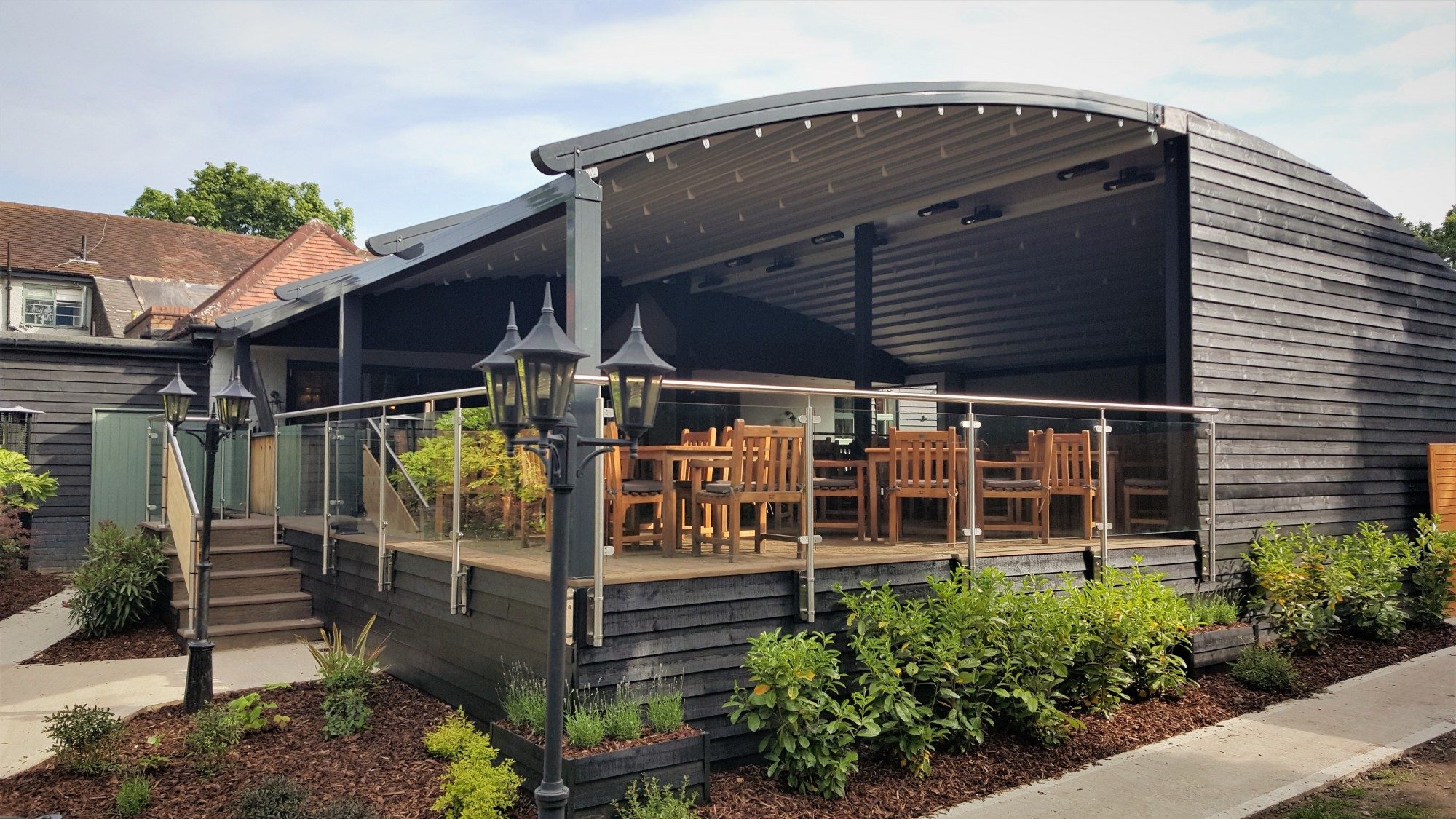 Outdoor event space at The Gate Arkley with modern patio and elegant lighting.