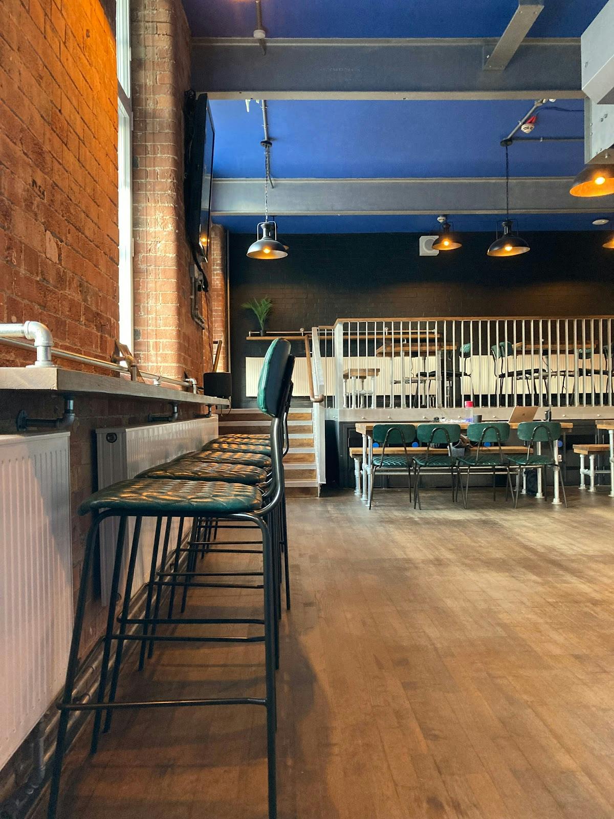 Versatile event space with industrial-chic design for meetings and workshops.