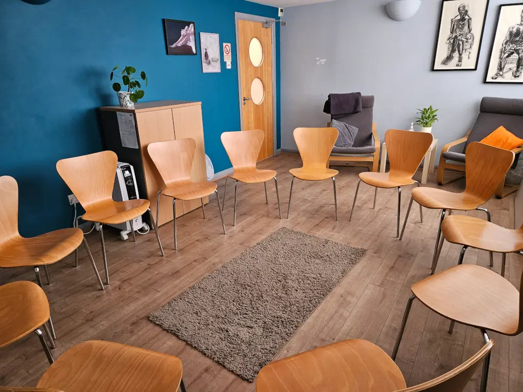 Warm Space at Hope Corner: circular seating for collaborative workshops and group sessions.