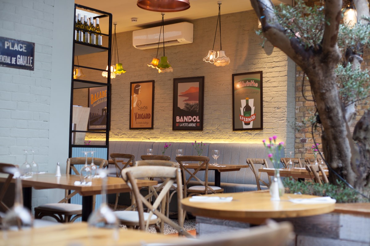 Charming La Petite Auberge restaurant with warm lighting, ideal for intimate events.