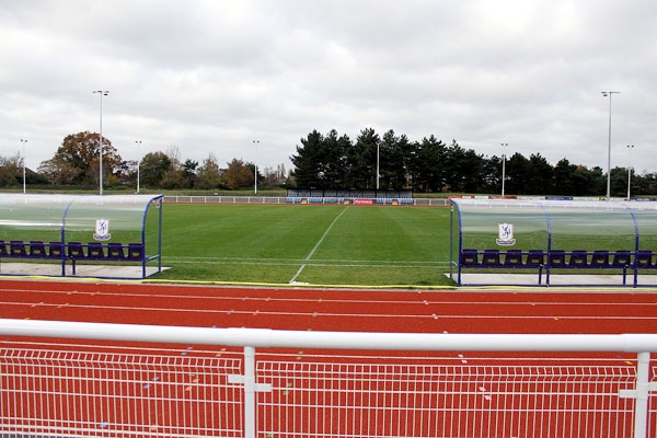 Main Stand Seating at Enfield Town FC, ideal for outdoor events and team-building activities.