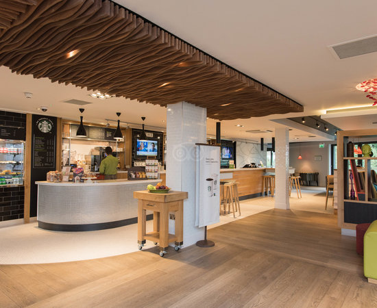 Modern café space in Holiday Inn Brentford, ideal for networking events and meetings.
