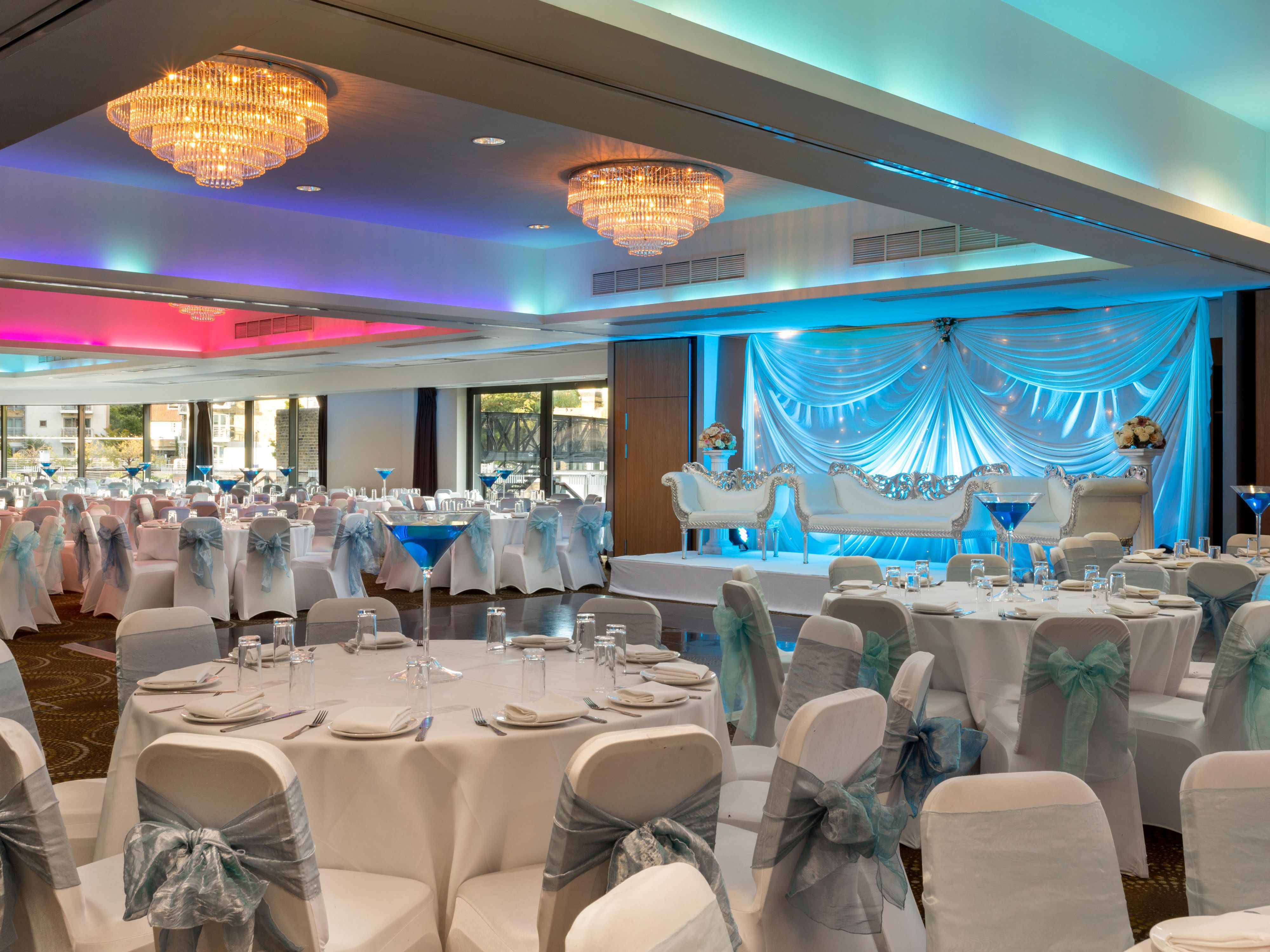 Elegant wedding event space at Holiday Inn Brentford with blue and white decor.