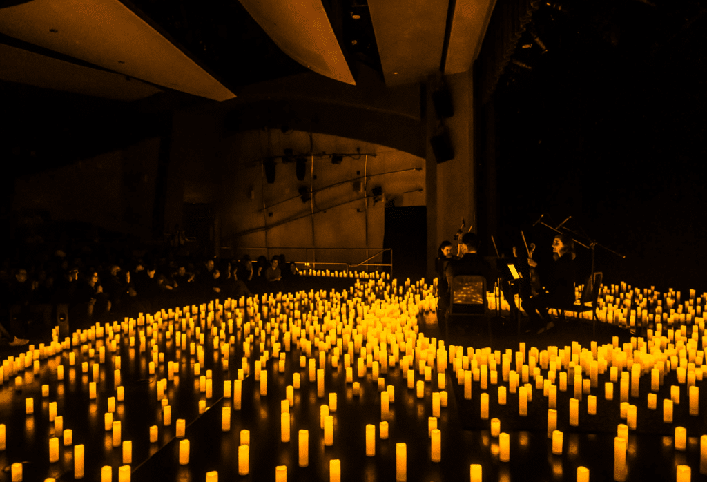 Main Auditorium at Adams Avenue Theater, candlelit event space for intimate performances.