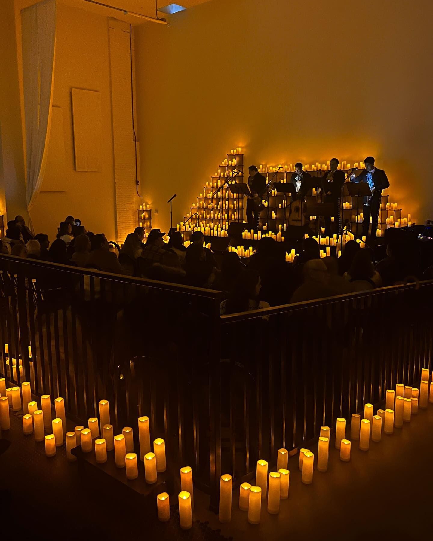 Elegant event space with candlelight, ideal for concerts and private parties.