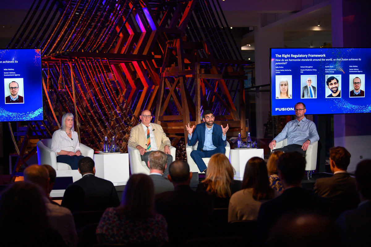 Panel discussion at The Science Museum, featuring diverse speakers in a modern setting.
