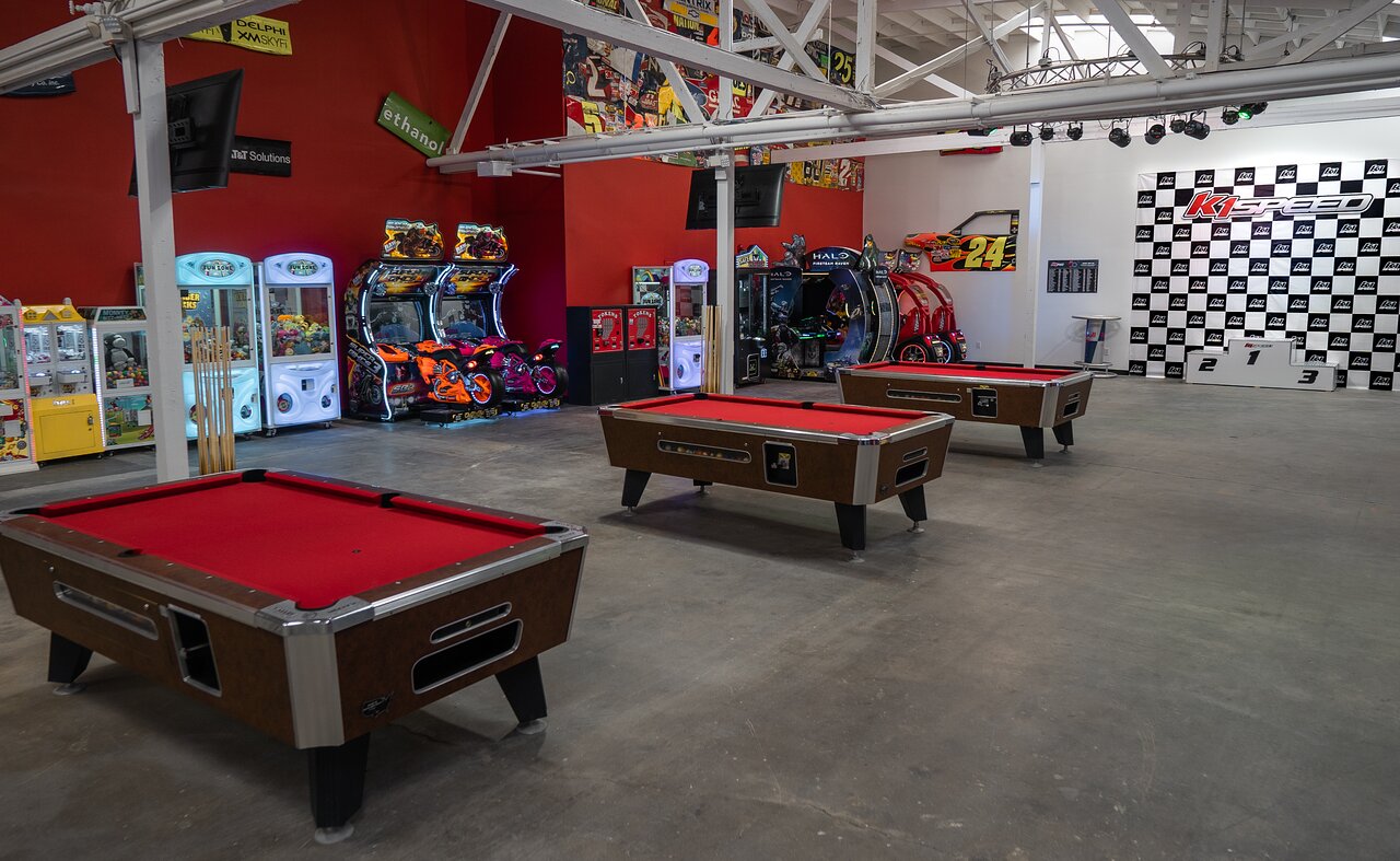 Vibrant arcade space with pool tables for casual networking and team-building events.