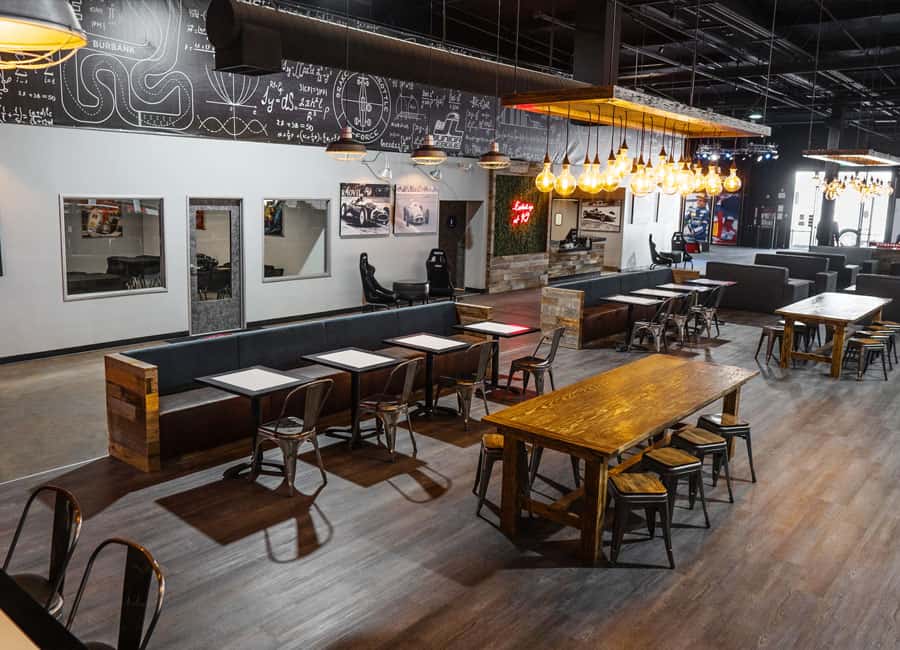 Paddock Lounge at K1 Speed Burbank, featuring industrial-chic decor for events.