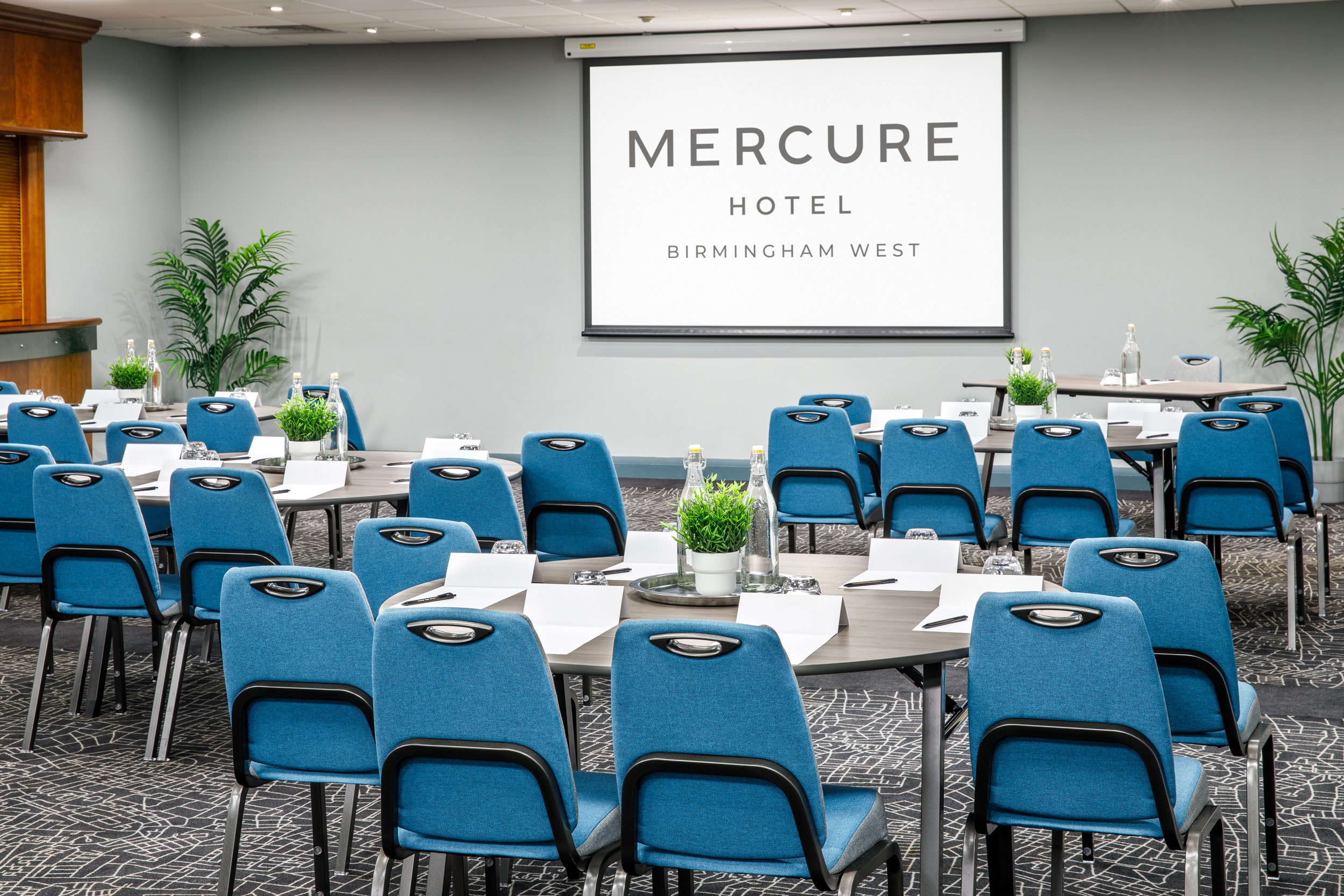 Hallard Suite at Mercure Birmingham West Hotel, ideal for conferences with blue chairs.