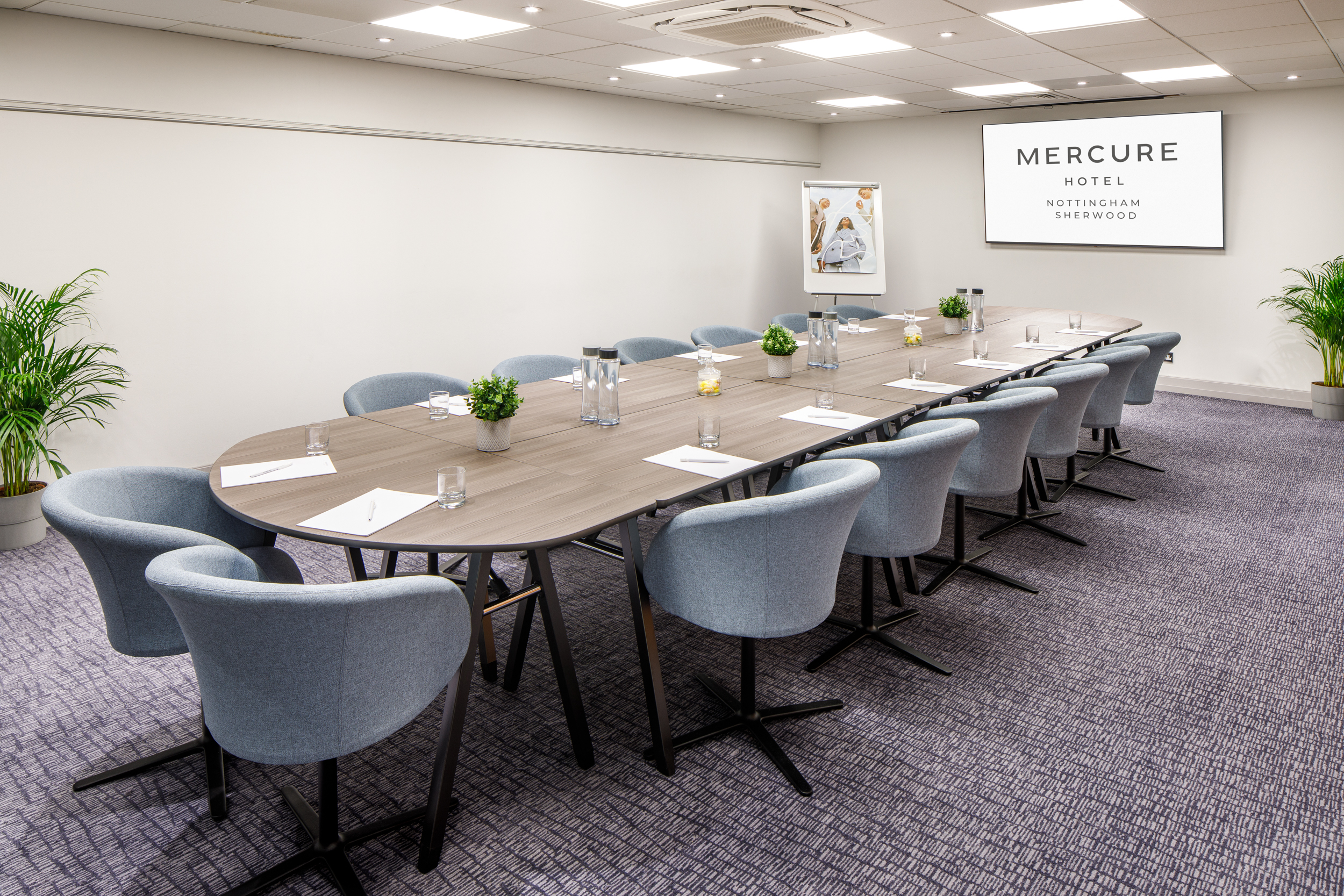 Meeting Room 2 at Mercure Nottingham: modern oval table, ideal for corporate meetings and workshops.