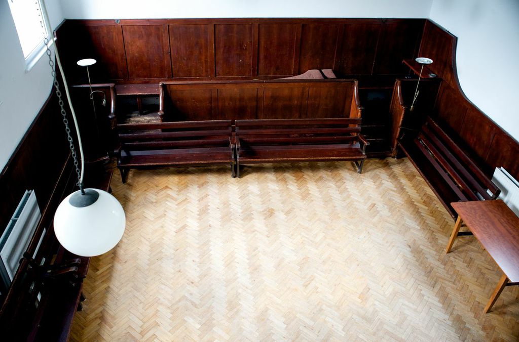 Large Meeting Room at Brentford Quaker House, spacious with wooden paneling for workshops.