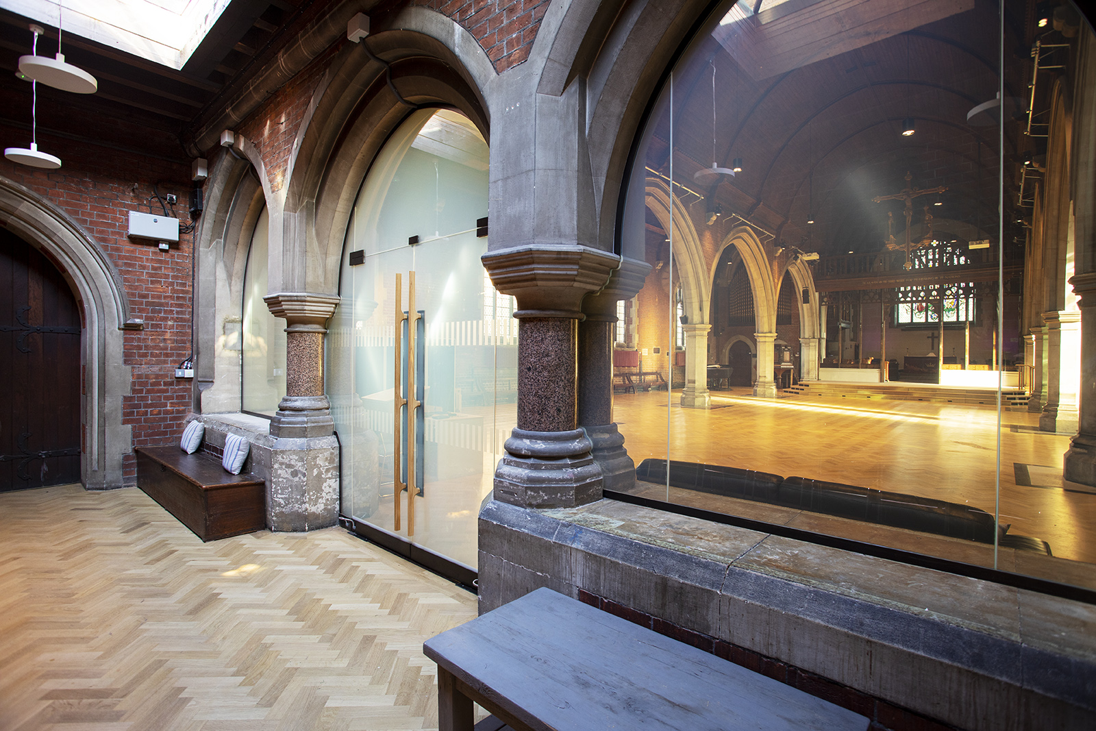Main Space in St Dionis Church with arched windows, perfect for events and gatherings.