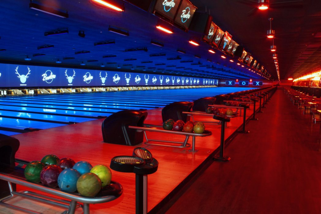 Vibrant bowling alley at Bowlero Cerritos for corporate events and team-building activities.