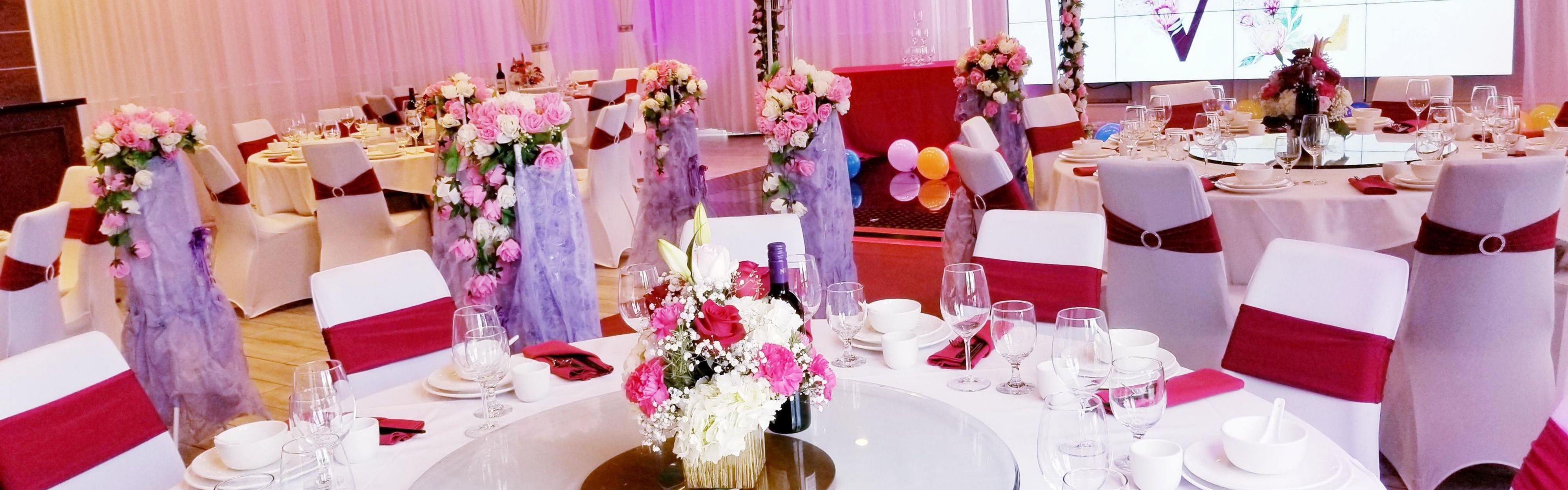 Elegant wedding event space with floral centerpieces at El Monte City Hall.