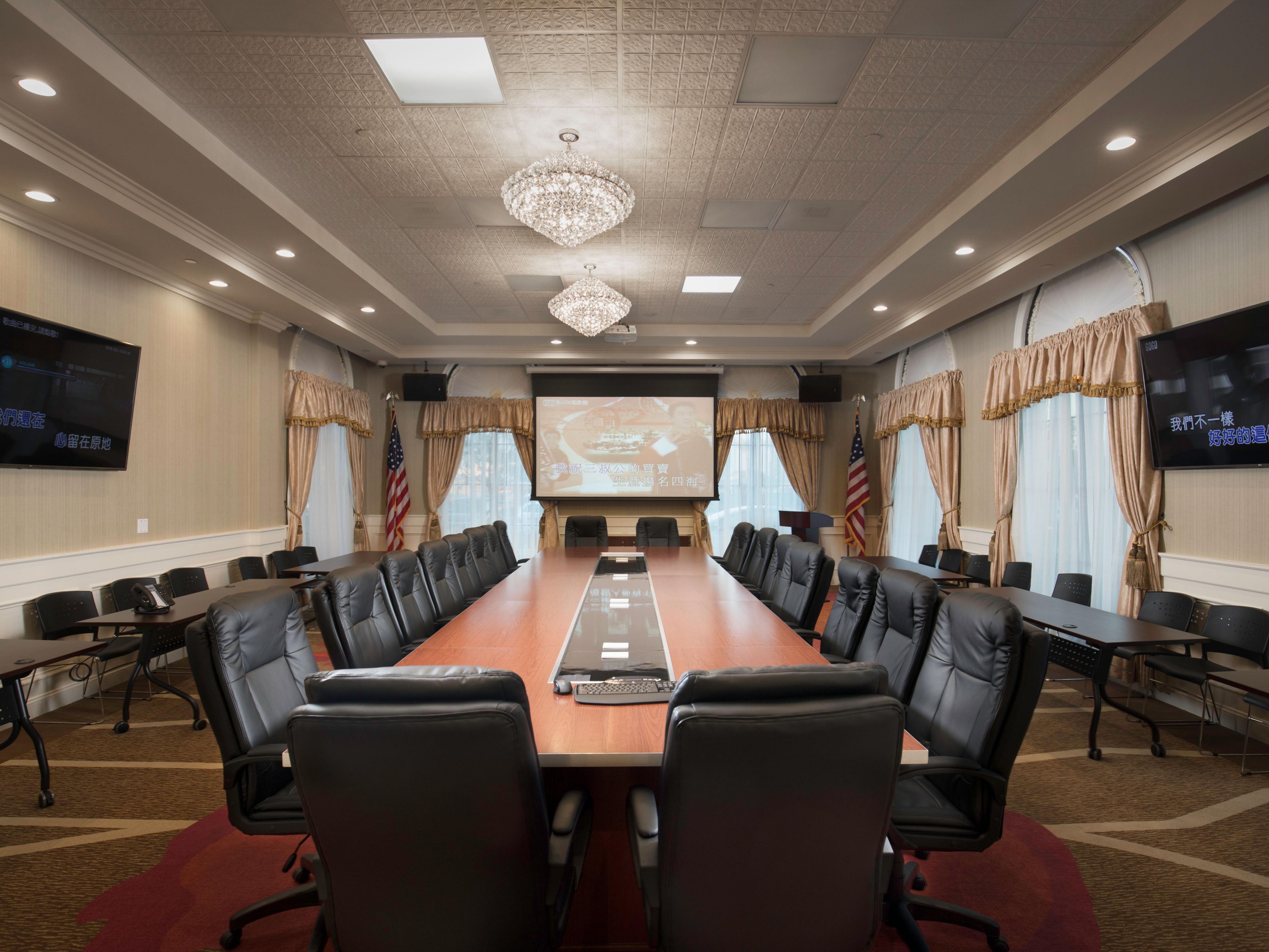 El Monte City Hall conference room with polished table, ideal for meetings and presentations.