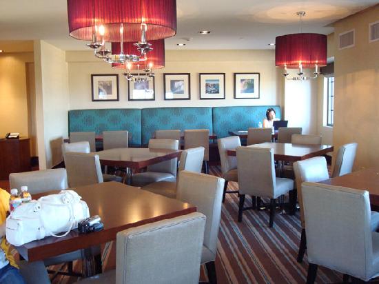 Club Lounge at Sheraton Garden Grove, modern meeting space for networking events.