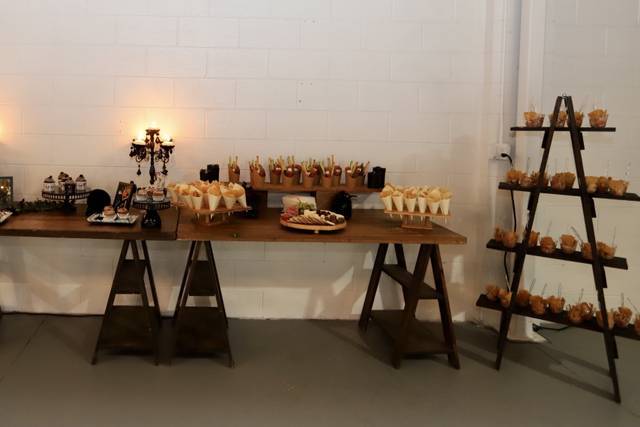 Dessert table with tiered displays at Rustic & Chic Co. for events and gatherings.