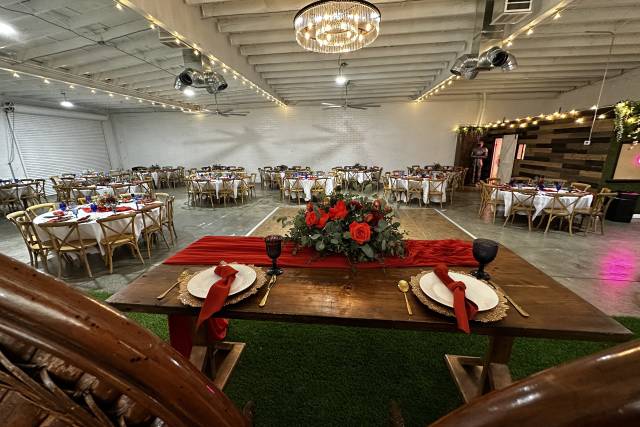 Elegant dessert table with floral arrangements for weddings and corporate events.