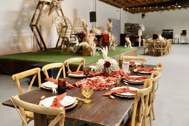 Rustic dessert table with dried flowers for elegant event gatherings and celebrations.
