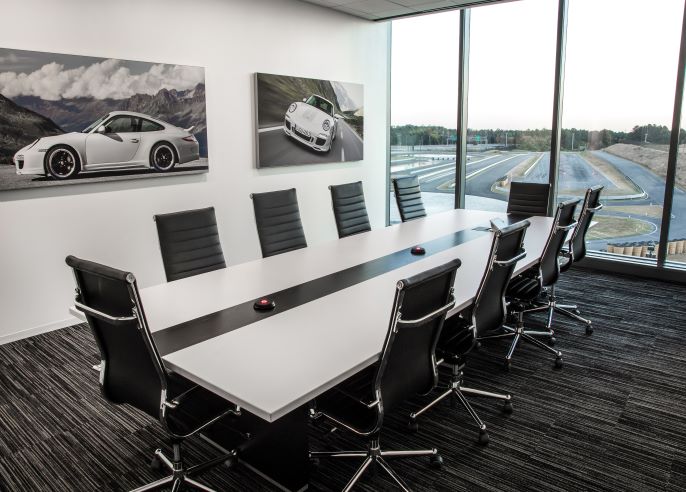 Modern conference room at Porsche Experience Center, ideal for corporate events and meetings.