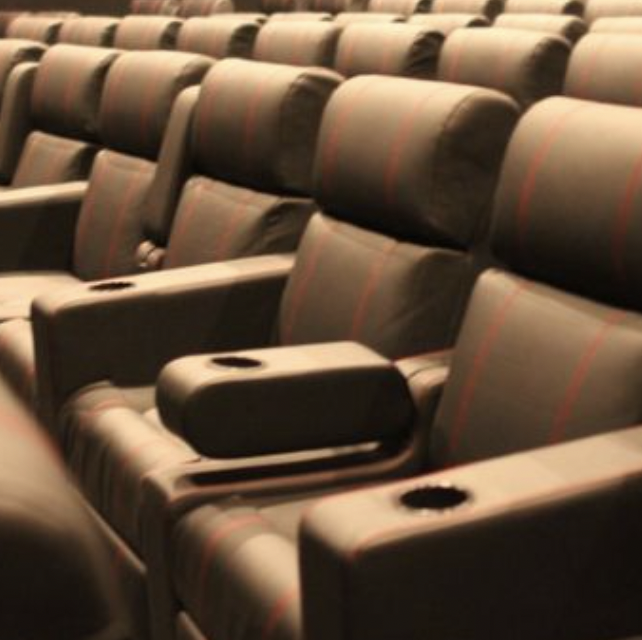 Plush leather seating with cup holders at UltraStar Cinemas for screenings and events.