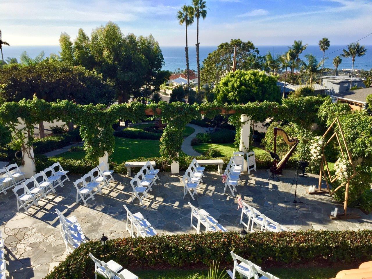Balcony at The Thursday Club with white chairs, perfect for weddings and corporate events.