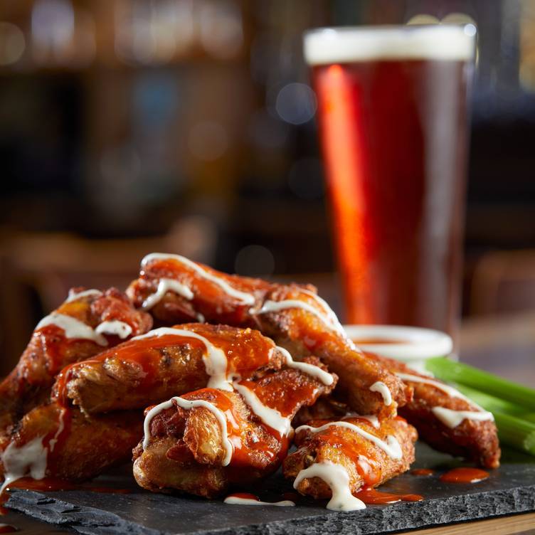 Main Dining Area at BJ's Restaurant: saucy chicken wings for events and gatherings.