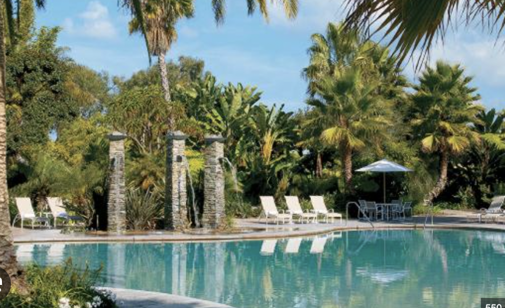 Lagoon Pool at The Point: serene venue with tropical landscaping for outdoor events.