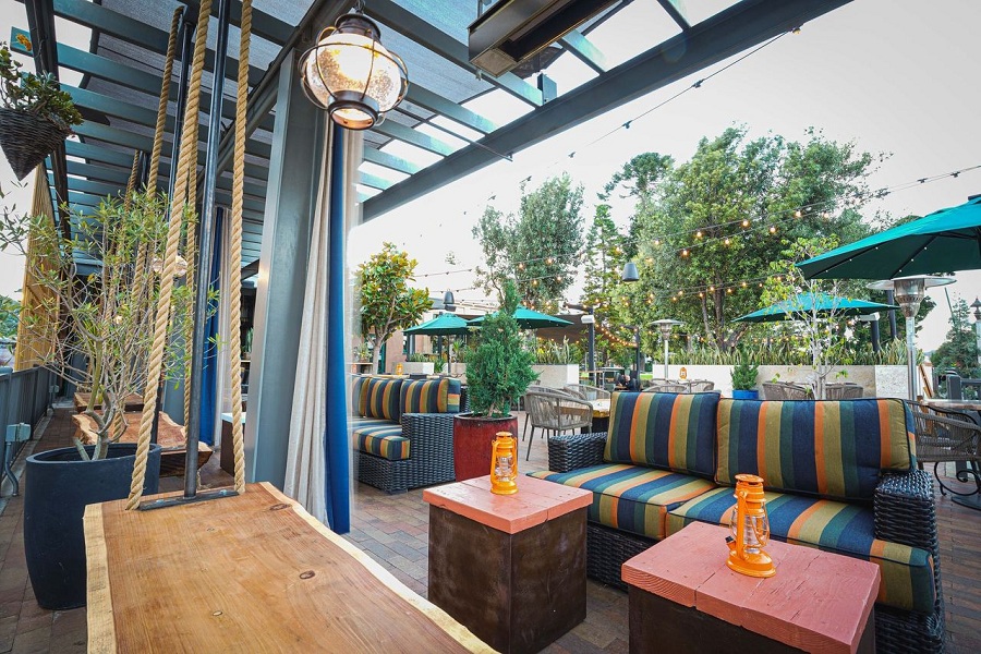Vibrant outdoor event space with colorful cushions for casual gatherings and networking.