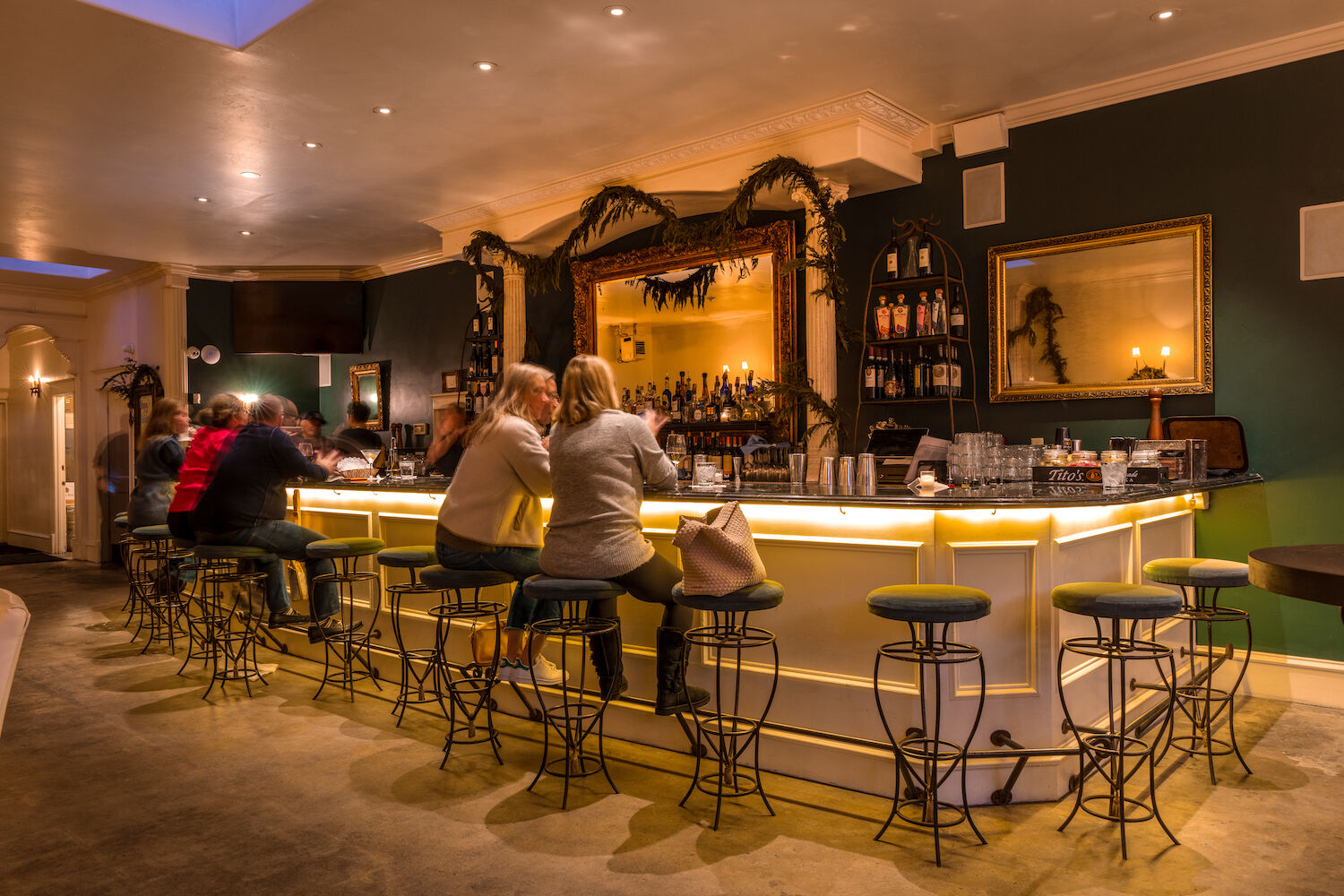 Chic Bar at Old Venice: modern decor, warm lighting for networking events and gatherings.