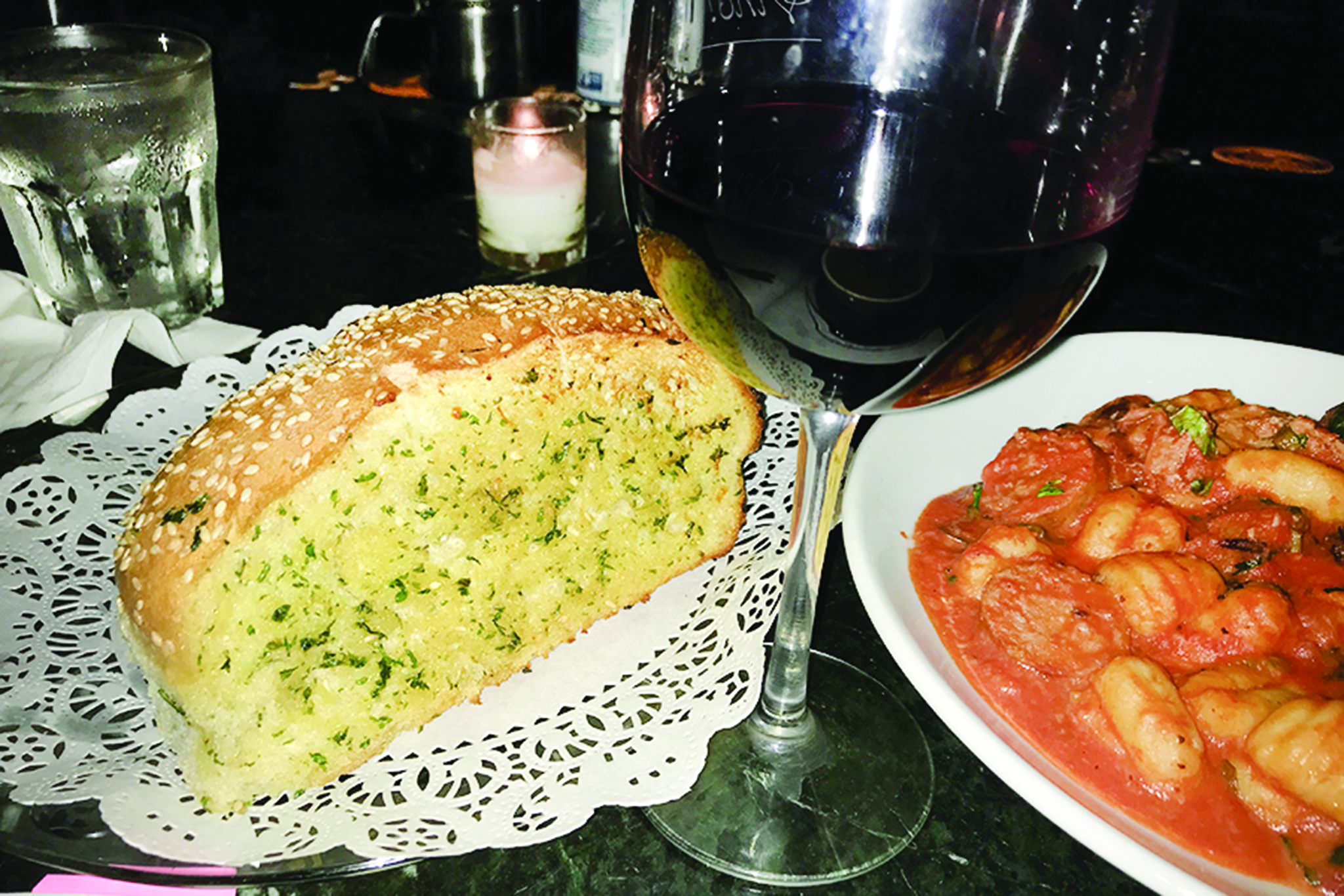 Chic Bar dining with gnocchi, garlic bread, and red wine for events in Old Venice.