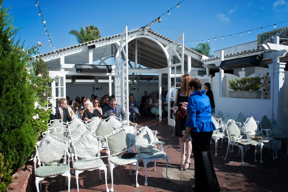 Outdoor event venue in Old Venice with elegant seating and vibrant atmosphere.