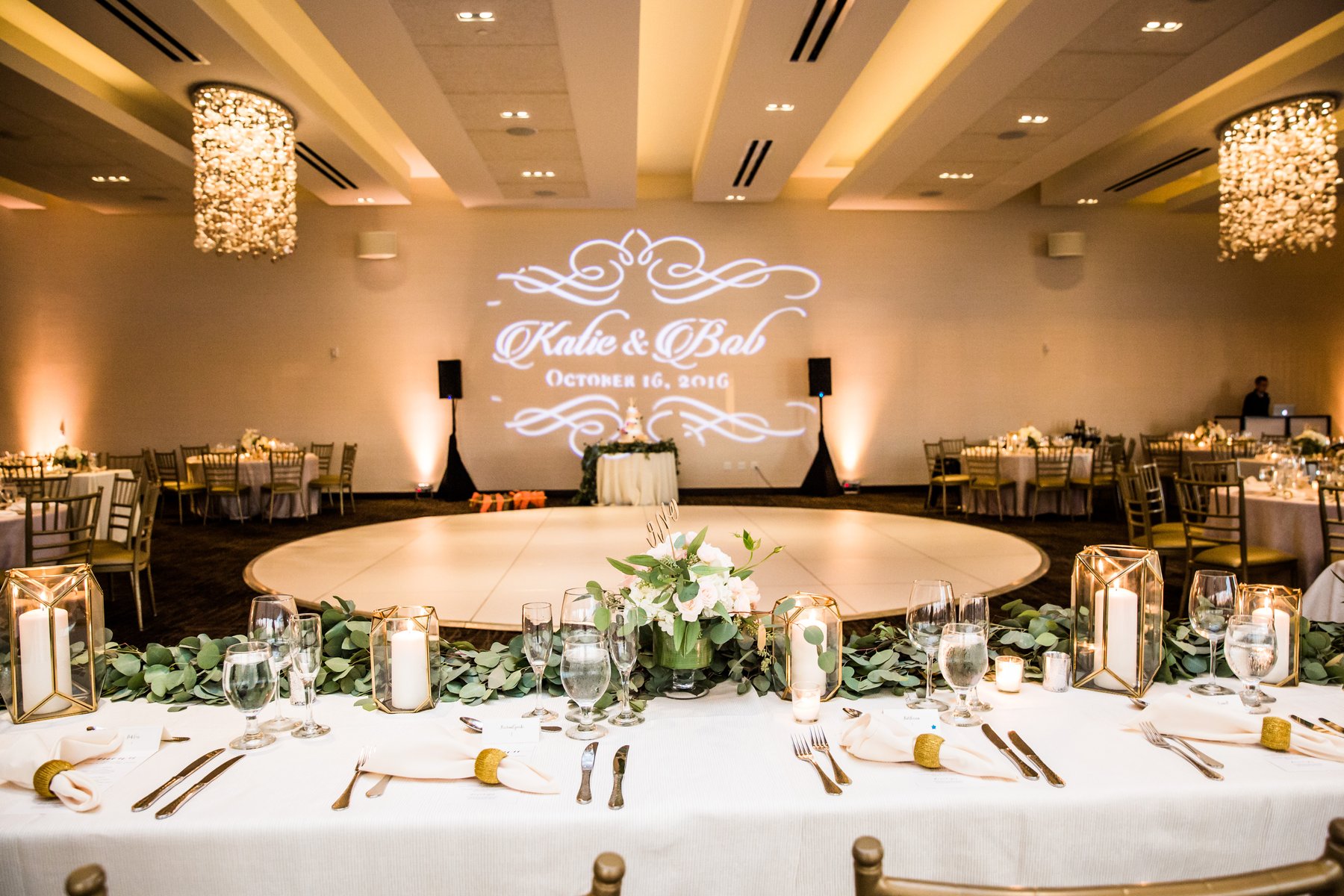 Elegant wedding banquet at Skyline Terrace with lush greenery and personalized decor.