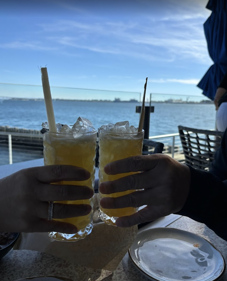 Refreshing cocktails clinking at Coasterra's Lanai Patio, perfect for networking events.
