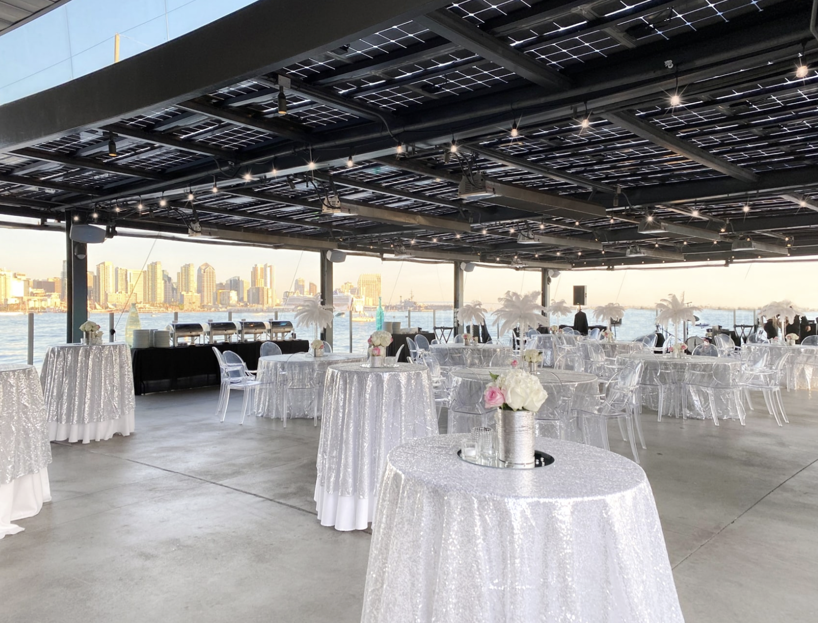 Elegant Lanai Patio at Coasterra, featuring silver tablecloths for upscale events.