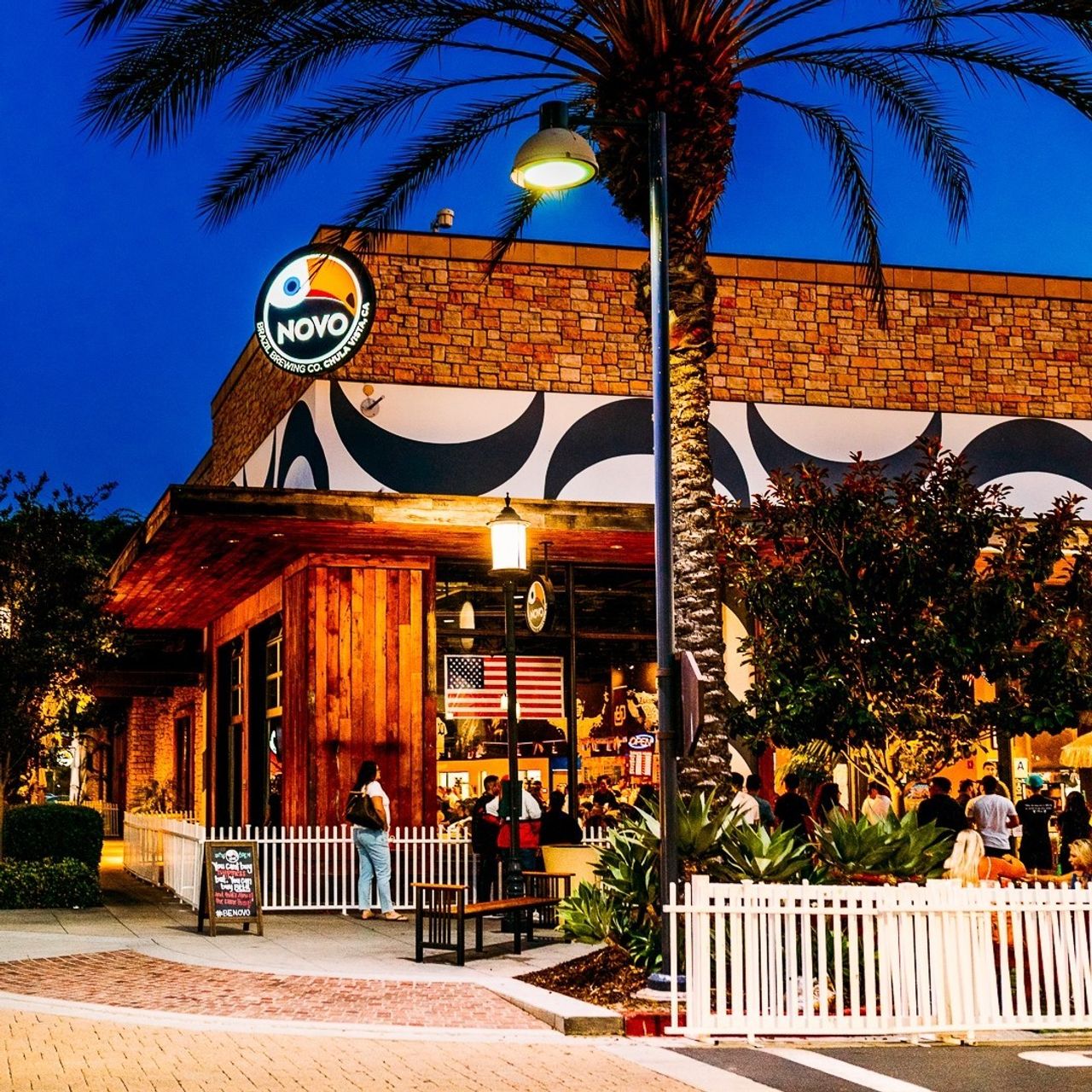 Vibrant restaurant venue with outdoor seating, perfect for events in Novo Brazil Brewing.