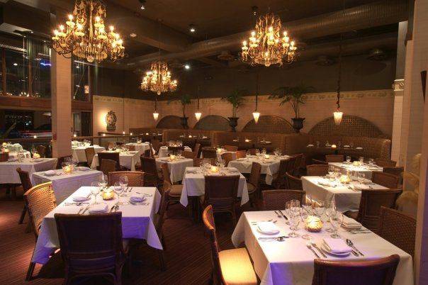 Elegant banquet hall with chandeliers, perfect for upscale events and fine dining.