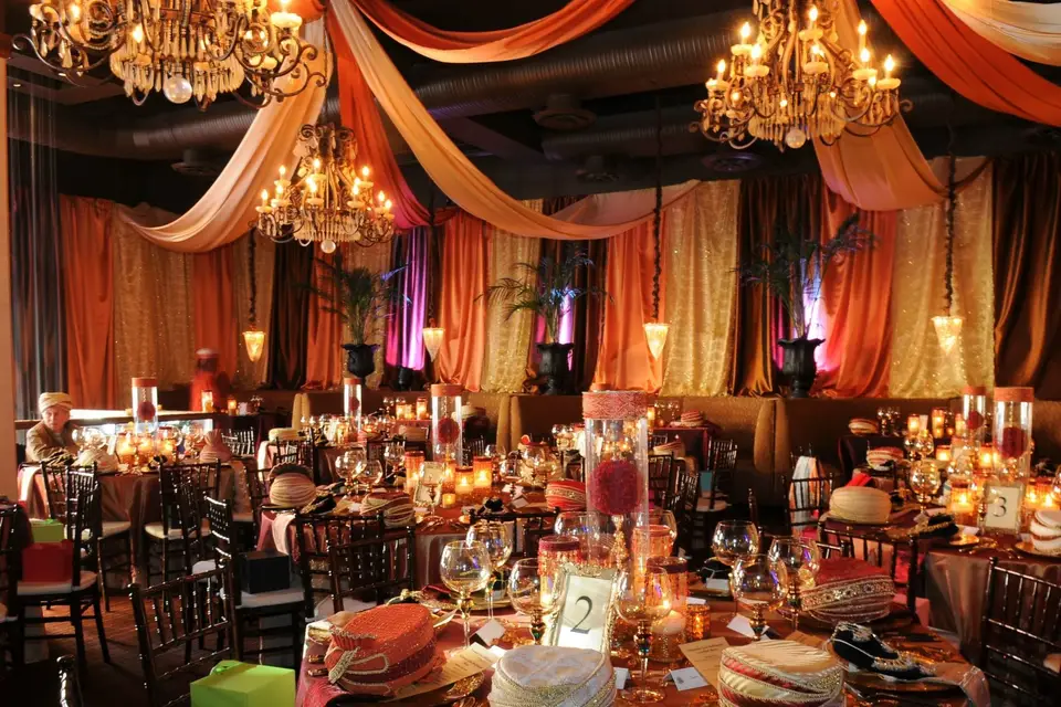 Elegant banquet hall with chandeliers, perfect for weddings and corporate events.